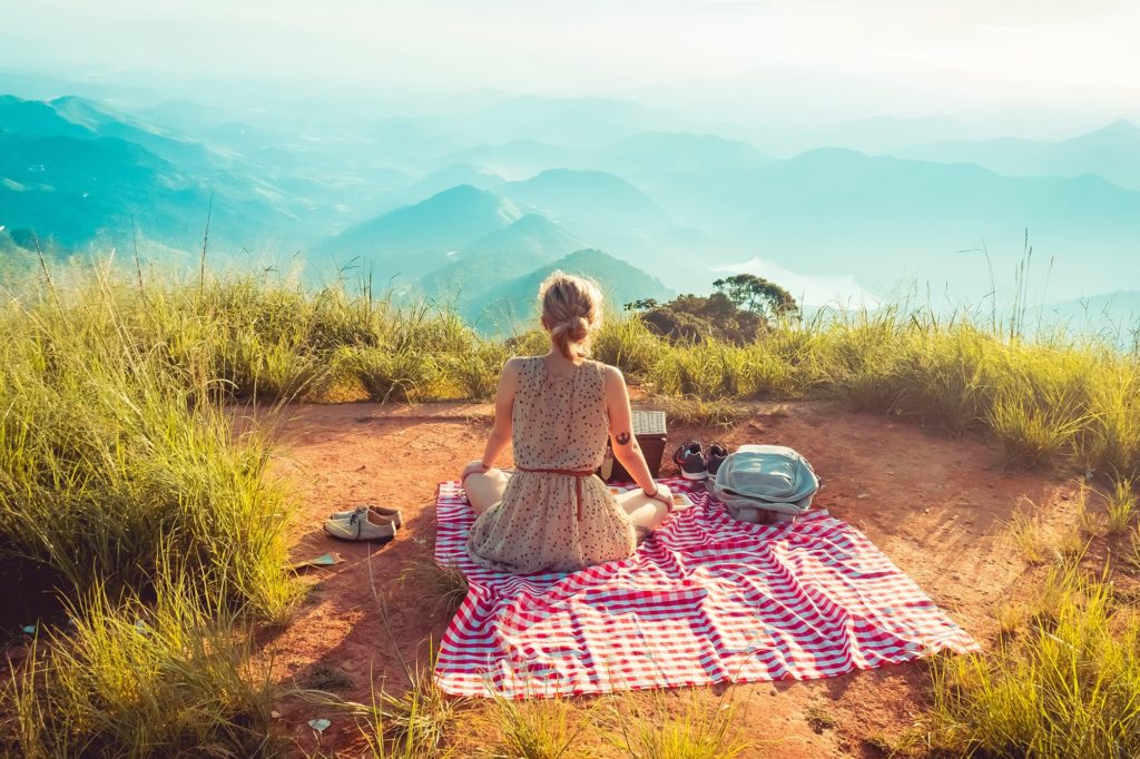 girl enjoying the view of mountains